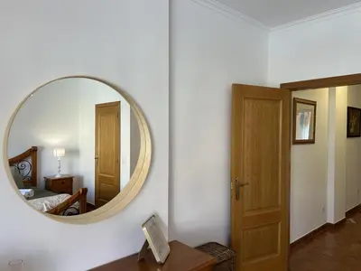 a mirror on a wall in a room at Moradia V2 - 200m da Praia da Oura - Santa Eulália in Albufeira