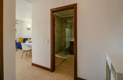 a mirror in a room with a living room at FLH Salgados Balcony Flat in Albufeira
