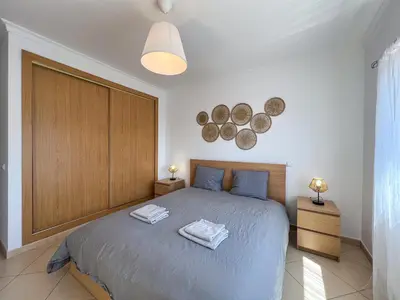 a bedroom with a bed with two towels on it at Charming 3-Bedroom Villa with Pool in Albufeira in Albufeira
