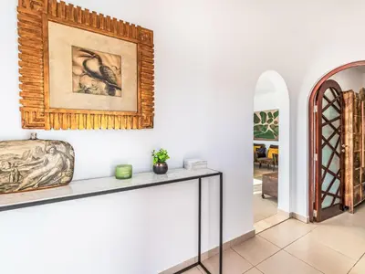 a living room with a table and a picture on the wall at Holiday Home Antonica by Interhome in Patroves
