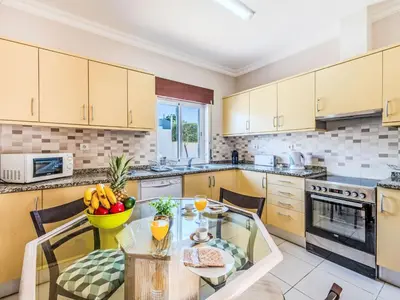 a kitchen with a table with a bowl of fruit on it at Holiday Home Antonica by Interhome in Patroves