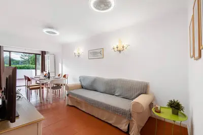 a living room with a couch and a table at Cool Motion 2149 in Albufeira