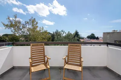 a large swimming pool in front of a building at Magnificent Beach Apartment in Albufeira