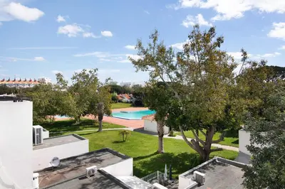 an aerial view of a yard with a swimming pool at Magnificent Beach Apartment in Albufeira