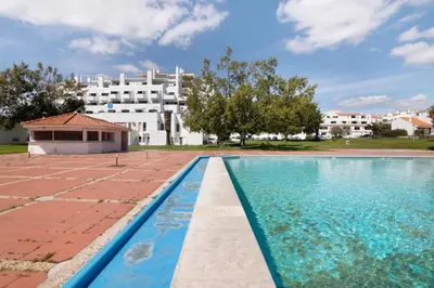 a view of the pool from the balcony of a apartment at Lovely And New Apartment In Oura in Albufeira