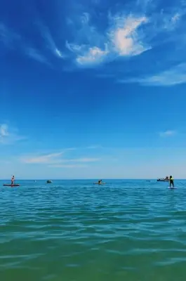 a group of people swimming in the ocean at Garrett by MTPhomes in Albufeira