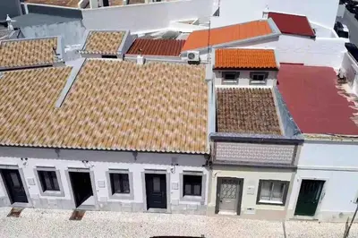 an overhead view of roofs on a building at Faro old town cosy typical house in Faro