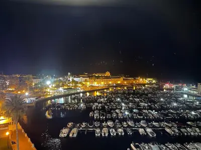 a group of boats docked in a harbor at night at Typical house Faro downtown private entrance in Faro