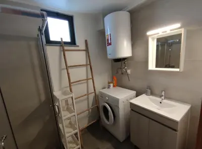 a small bathroom with a toilet and a sink at Typical house Faro downtown private entrance in Faro