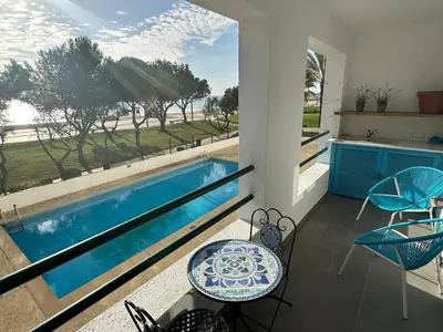 a view of a swimming pool from a house at Carteia Mar by FHR frente Mar & piscina in Quarteira