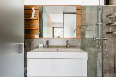 a bathroom with a sink and a mirror at Casa da Alegria, Vale do Lobo in Almancil