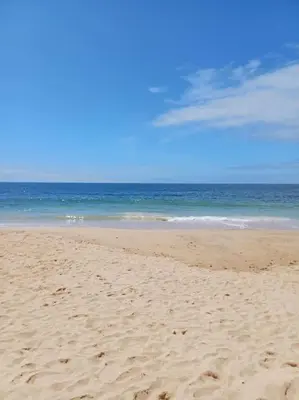 a sandy beach with the ocean in the background at Balaia Praia in Albufeira