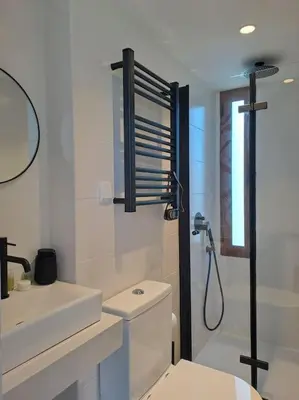 a bathroom with a toilet and a sink and a shower at Balaia Praia in Albufeira