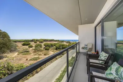 a balcony with a view of the ocean at Vista Mar in Quarteira