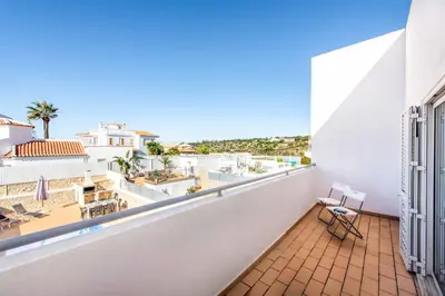 a balcony with a view of the city at Villa Felizalgarve in Albufeira