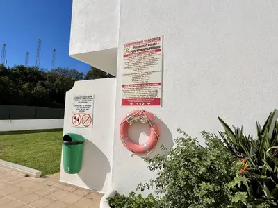 a sign on the side of a wall with a donut at Albufeira Town Apartment With Pool by Homing in Albufeira