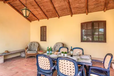 a dining room with a table and chairs at Villa Pardal in Albufeira