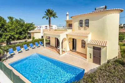 an aerial view of a house with a swimming pool at Villa Pardal in Albufeira