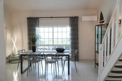 a dining room with a table and chairs at Apartment Berardo - Perfect for families in Albufeira