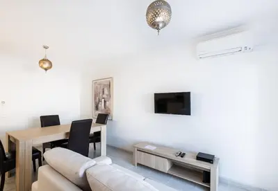 a living room with a couch and a table at Apartment Nidio - Great Location in Albufeira