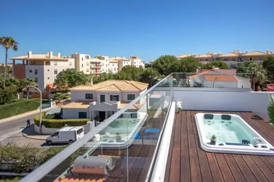 a house with a swimming pool on top of a roof at Crystal bay in Albufeira