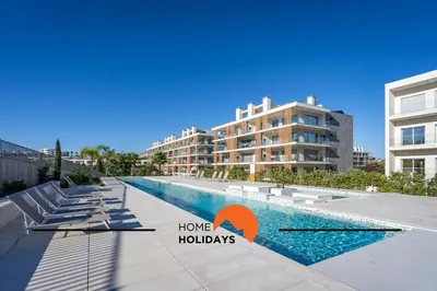 a swimming pool in the middle of a building at #264 Green Apartments C04 by Home Holidays in Albufeira