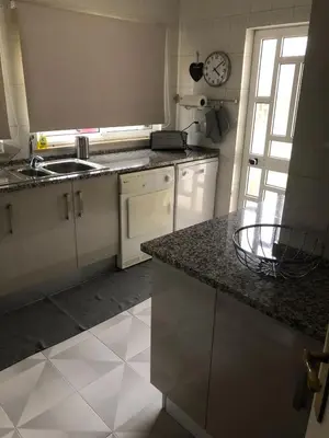 a kitchen with a sink and a counter top at Vivenda Fairways in Quarteira