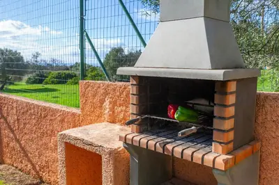 a bird is sitting inside of a brick oven at Townhouse Ocean Joy by Algarve Vacation in Albufeira