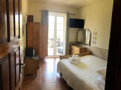 a bedroom with a bed with two towels on it at Old Village Vilamoura Beautiful 3 Bed townhouse in Vilamoura