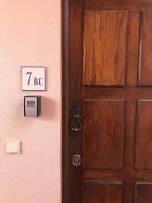 a wooden door with a sign that reads bc at Old Village Vilamoura Beautiful 3 Bed townhouse in Vilamoura
