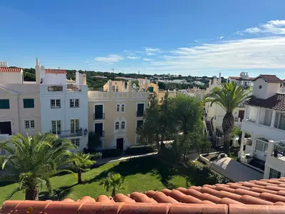 an aerial view of a city with palm trees and buildings at Old Village Vilamoura Beautiful 3 Bed townhouse in Vilamoura