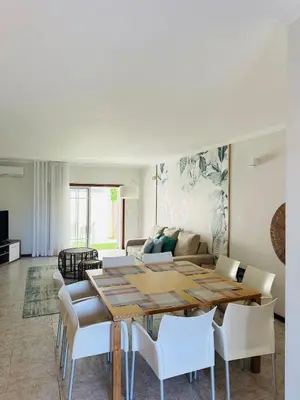 a living room with a table and chairs at Appartement Talia in Albufeira