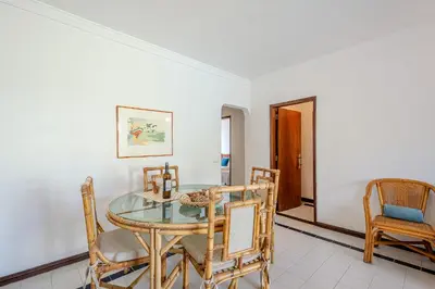 a dining room with a glass table and chairs at Casa Rita by Sunnyway in Olhos de Água