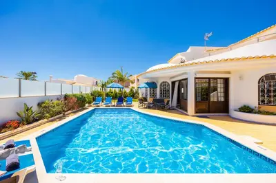 a swimming pool in the backyard of a house at Villa Cristina 15 in Albufeira