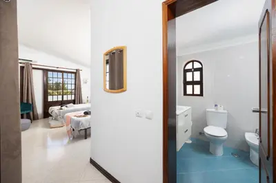 a bathroom with a toilet and a sink at Villa Cristina 15 in Albufeira