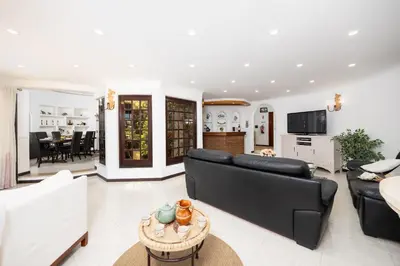 a living room with a couch and a table at Villa Cristina 15 in Albufeira