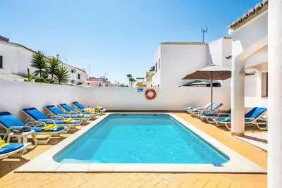 an aerial view of a house with a swimming pool at Villa Serenity in Albufeira