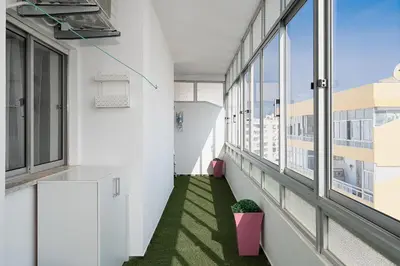 an office corridor with windows and green grass at ISA - Quarteira in Quarteira