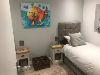 a bedroom with a bed and two night stands at Ville Verde in Loulé