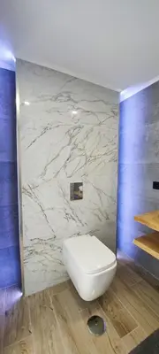 a bathroom with a sink and a toilet and a mirror at The View House in Albufeira