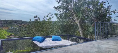 two blue pillows sitting on top of a balcony at The View House in Albufeira