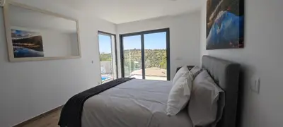a bathroom with a large white tub in a room at The View House in Albufeira