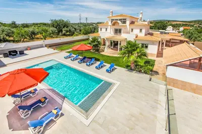 an aerial view of a house with a swimming pool at Villa Dourado in Boliqueime