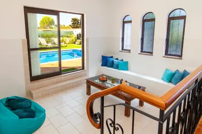 a living room with a couch and a table at Villa Bellegarde by Algarve Vacation in Albufeira