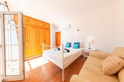 a bedroom with a crib in a room at Villa Sunny Joy by Algarve Vacation in Albufeira