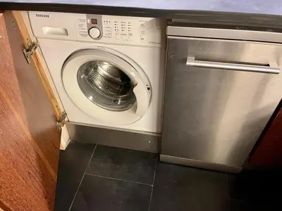 a white washer and dryer in a kitchen at Barca do Lago - Vilamoura in Vilamoura