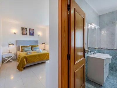 a bedroom with a bed with towels on it at Apartment Valmangude Sunny Escape - VIP Properties by Interhome in Albufeira