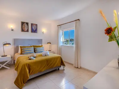 a living room with a table and a couch at Apartment Valmangude Sunny Escape - VIP Properties by Interhome in Albufeira