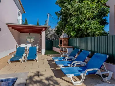 a bedroom with a bed and a large window at Holiday Home V3 Aguia M - VIP Properties by Interhome in Albufeira