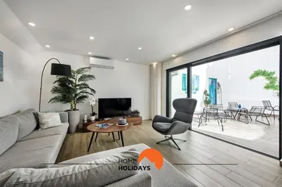a living room with a couch and a table at #211 Cerro Lagoa by Home Holidays in Albufeira